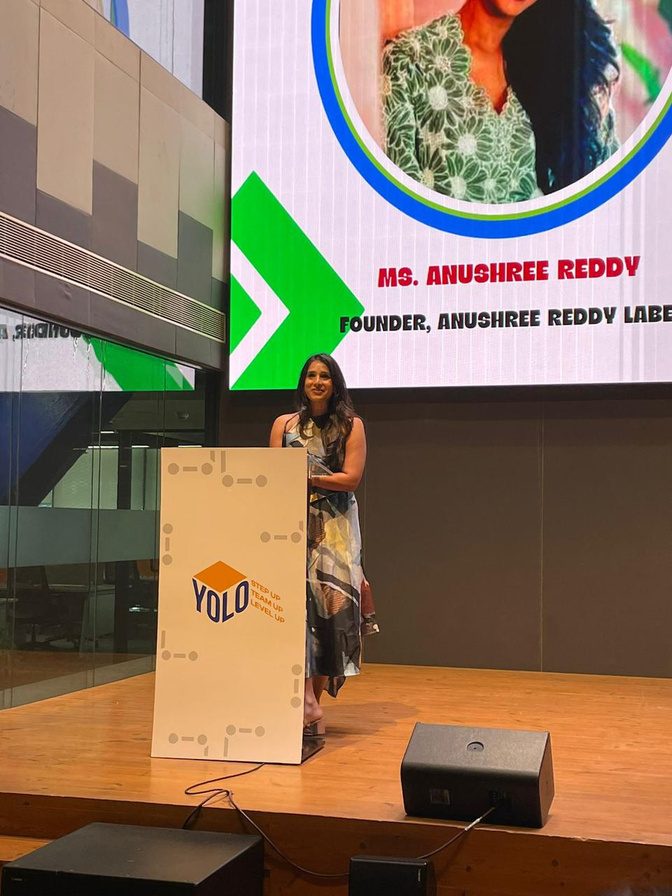 Anushree Reddy speaking at the YOLO podium